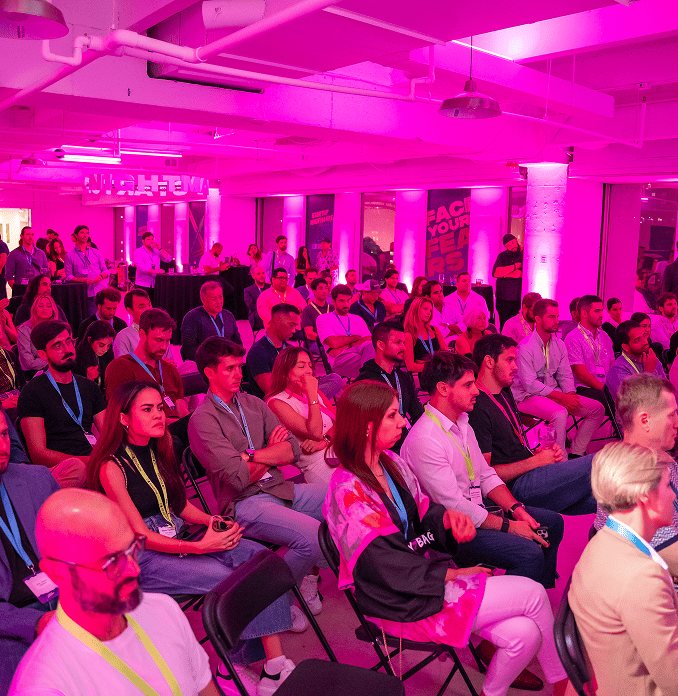 Attendees at innovation and startup event networking.